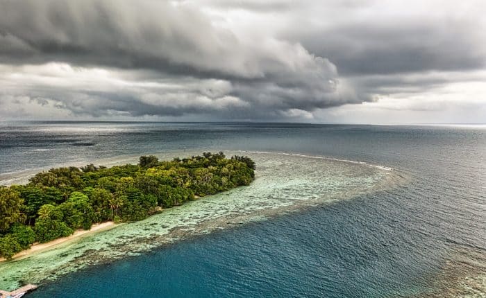 aerial view of the island meeting the ocean