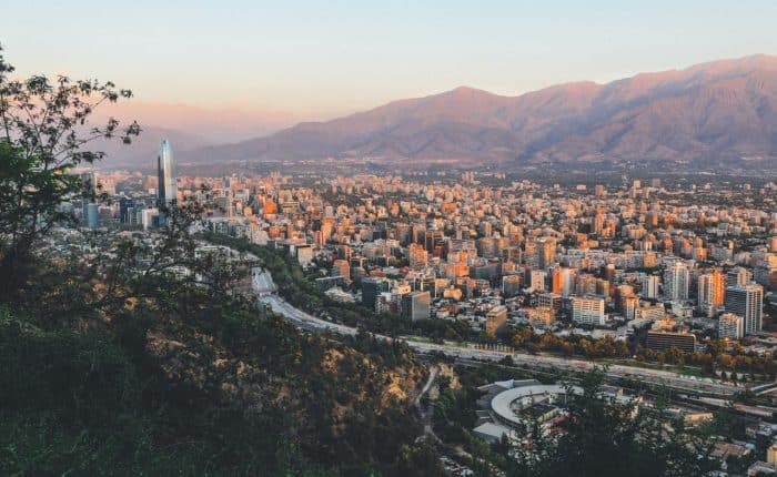 aerial view of the city right next to the mountains