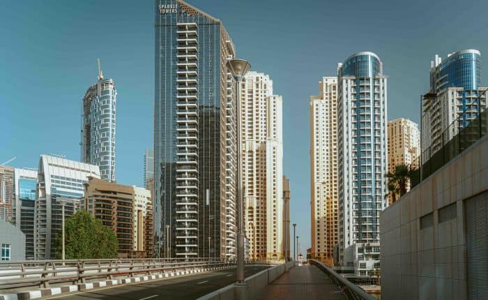 view of dubai's highrise buildings from a highway