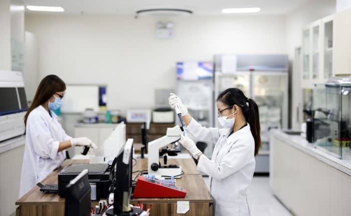 two scientist doing medical procedures