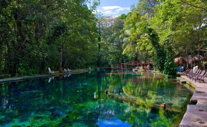 beautiful lake with chairs around
