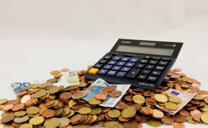 coins, bills and calculator