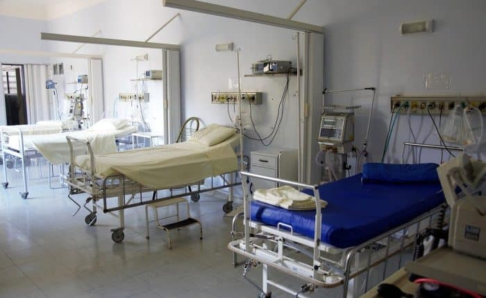 3 empty hospital beds