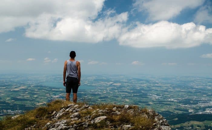 Man standing on mountain top