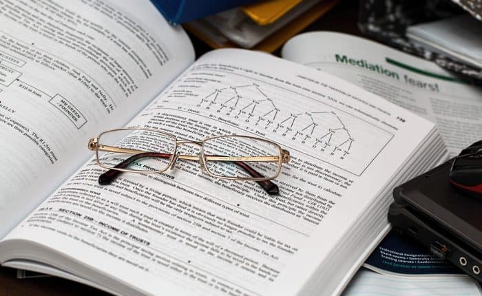 glasses on top of a tax book