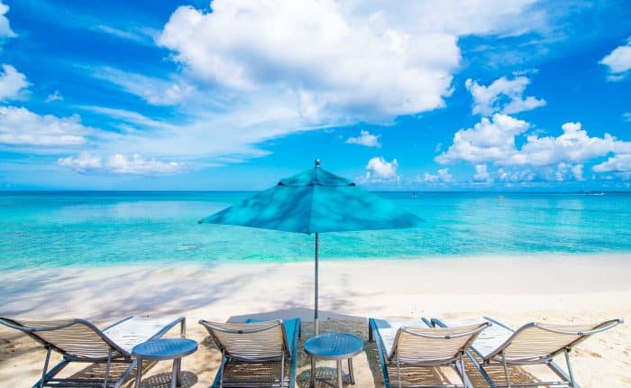 beach with blue umbrella at Cayman Island