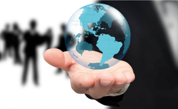 guy with hand holding the world