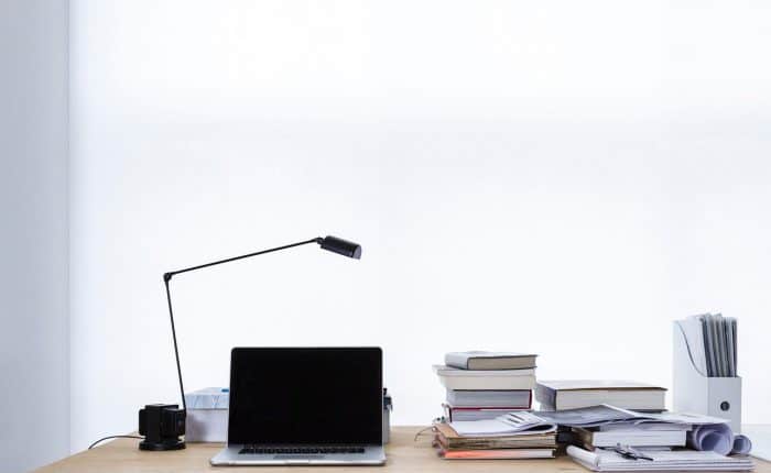 Laptop and books on desk