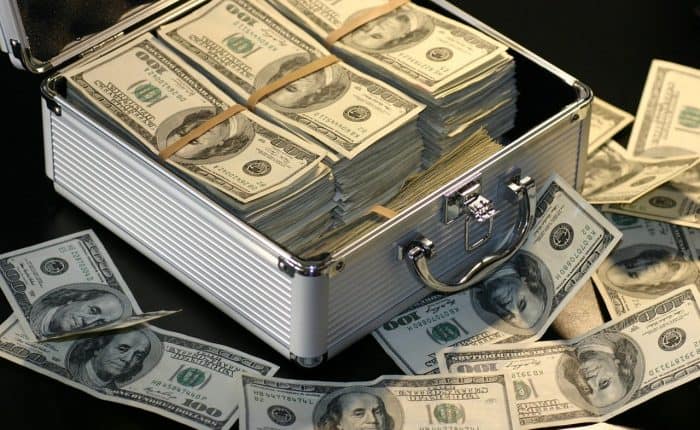 Piles of money in a suitcase
