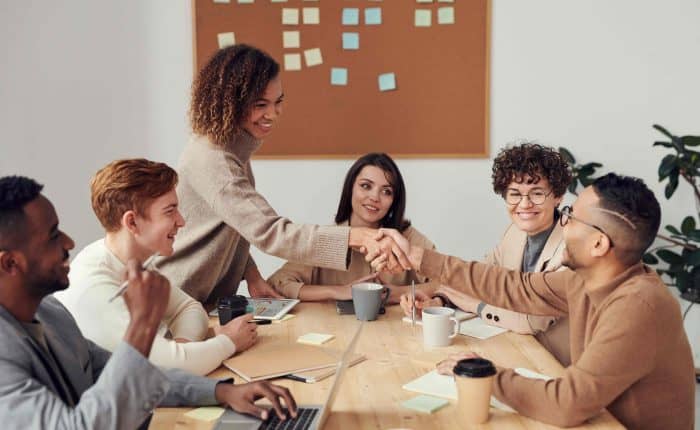 people sitting around a table working together