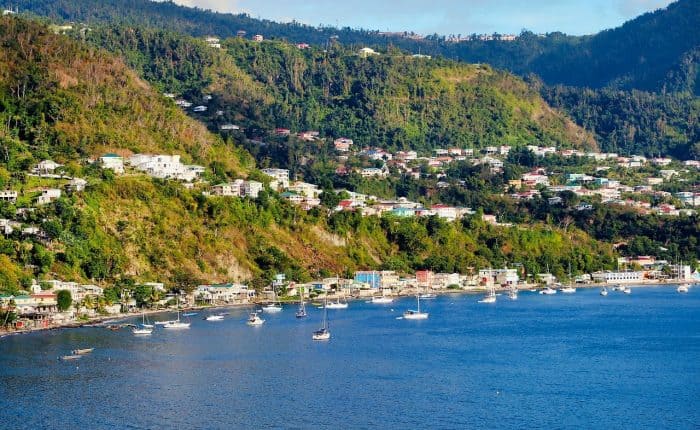 beautiful view of the sea, the buildings, and the moutains in the distance