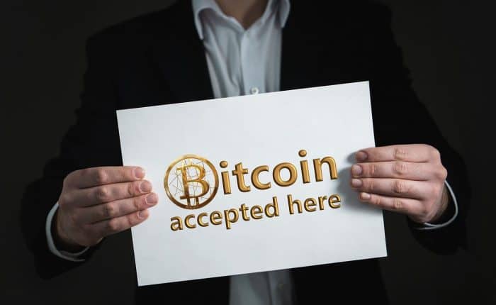 Sign says 'Bitcoin accepted here'