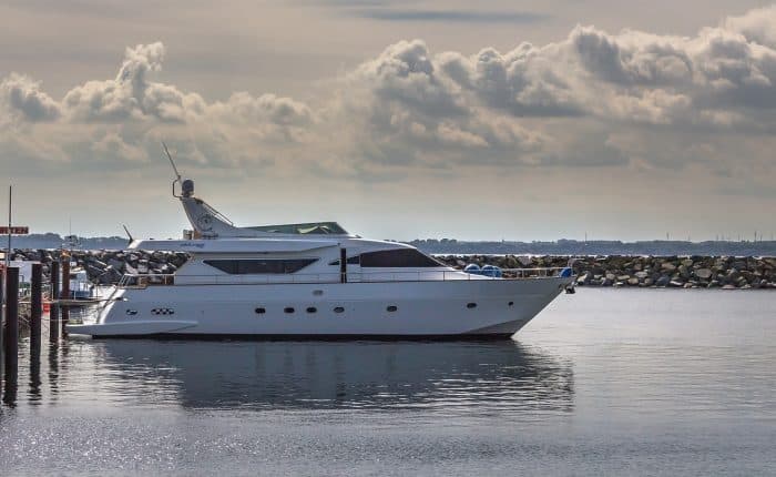 white yacht by the shore