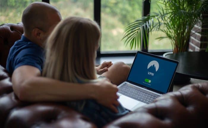 couple looking at their laptop VPN