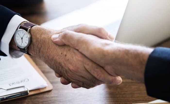 two men shaking hands