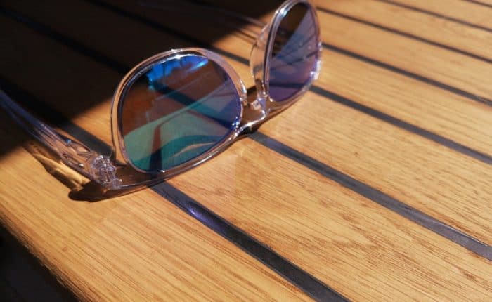 sunglasses on a teak table