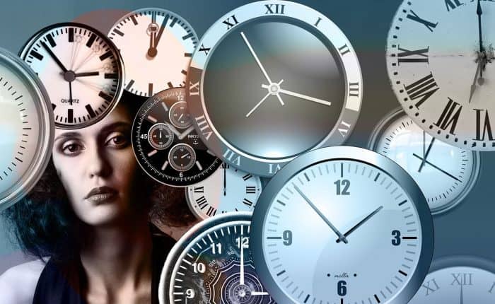 woman with lots of clocks