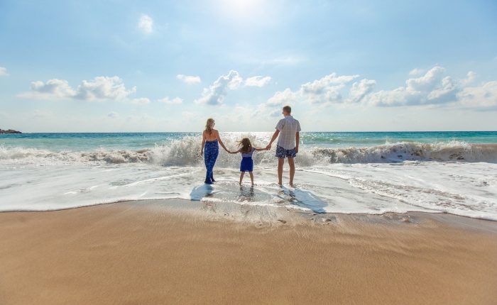 Family walking on the beach