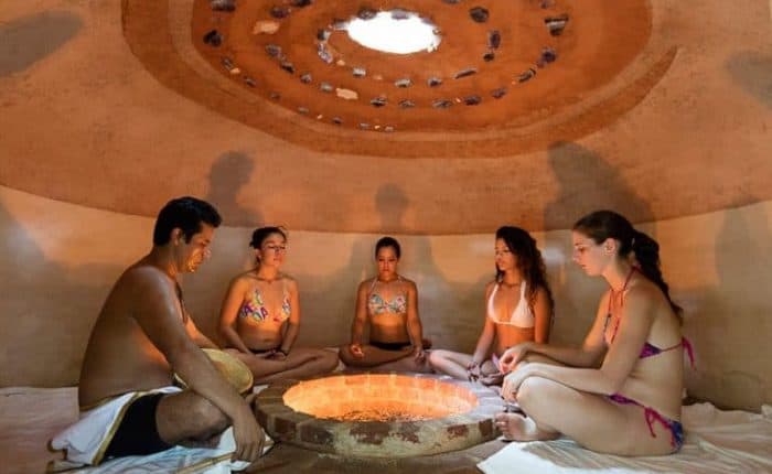 Five adults in a hut in spa