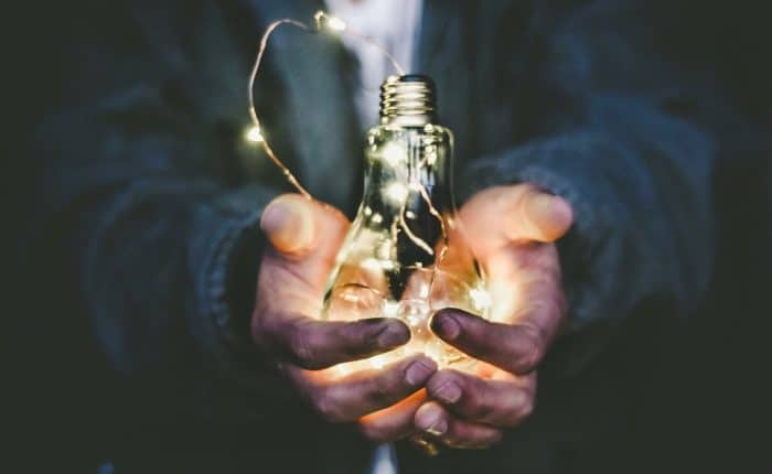 Man holding a light bulb